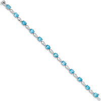 14K White Gold 7-Inch Bracelet with Oval Swiss Blue Topaz and Round Diamonds - 0.75 Carats Total Swiss Blue Topaz Weight, 0.004 Carats Total Diamond Weight by Oro Pregiato