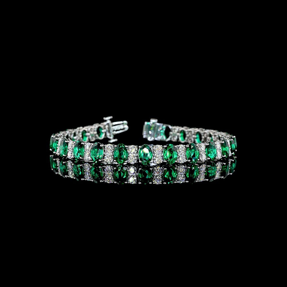 14K White Gold 7-Inch Tennis Bracelet with Prong-Set Oval Lab-Grown Green Emeralds - 4.74 Carat Total Weight - Covaloro Fine Jewelry