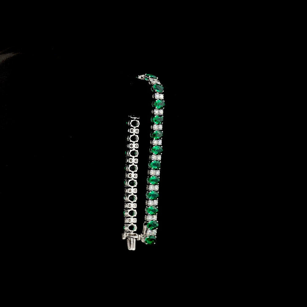 14K White Gold 7-Inch Tennis Bracelet with Prong-Set Oval Lab-Grown Green Emeralds - 4.74 Carat Total Weight - Covaloro Fine Jewelry