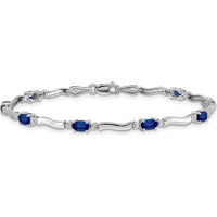 14K White Gold 7" Tennis Bracelet with Oval Sapphires and Round Diamonds - 0.21 Carats Total Sapphire Weight, 0.01 Carats Total Diamond Weight by Monteluci Fine Jewelry