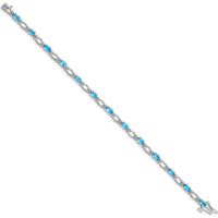 14K White Gold 7" Tennis Bracelet with Oval Swiss Blue Topaz and Round Diamonds - 0.30 Carats Total Topaz Weight by Monteluci Fine Jewelry