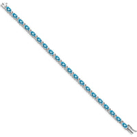 14K White Gold 7" Tennis Bracelet with Oval Swiss Blue Topaz and Round Diamonds - 0.56 Carats Total Topaz Weight by Monteluci Fine Jewelry