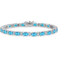 14K White Gold 7" Tennis Bracelet with Oval Swiss Blue Topaz and Round Diamonds - 0.56 Carats Total Topaz Weight by Monteluci Fine Jewelry
