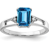 14K White Gold 7x5mm Emerald Cut Swiss Blue Topaz Ring with Diamond Accents - 1.3 Carat Total Blue Topaz Weight, 0.02 Carat Diamond Weight by Monteluci Fine Jewelry