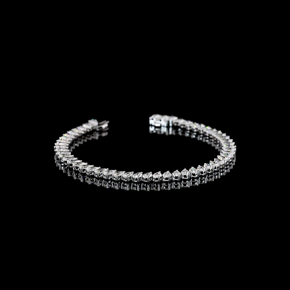 14K White Gold 8.86 Carat Pear-Shape Tennis Bracelet with Inclined Prong-Set E-F VS1 Lab Diamonds - 52 Stones - Covaloro Fine Jewelry