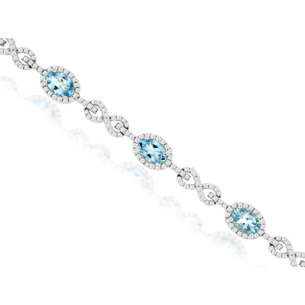 14K White Gold Aquamarine & Diamond Station Bracelet with Oval Halo and Pavé Infinity Links - 3.36 Carat Aquamarine and 2.00 Carat Total Diamond Weight - Royal Jewelry