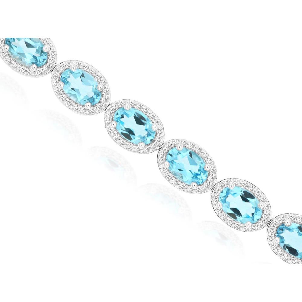 14K White Gold Blue Topaz & Diamond Tennis Bracelet with Oval Cut Gemstones and Milgrain Halo Details - 10.50 Carat Total Blue Topaz Weight, 1.40 Carat Total Diamond Weight - Royal Jewelry