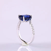 14K White Gold Bypass Ring with 3.59 Carat Emerald Cut Blue Lab Sapphire and 0.24 Carat Round Lab Diamond Accents - Total 3.88 Carats - Covaloro Fine Jewelry