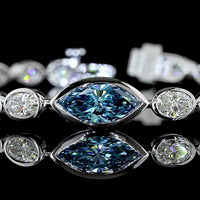 14K White Gold East-West Marquise and Oval Tennis Bracelet with 1.30 Carats Fancy Vivid Blue Lab Diamond and 6.72 Carats Colorless Lab Diamonds - 8.02 Carats Total Weight - Covaloro Fine Jewelry