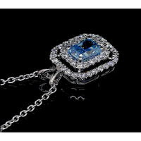 14K White Gold East-West Radiant Cut Double Halo Pendant with Fancy Vivid Blue Lab Diamond - 0.72 Total Carat Weight - Covaloro Fine Jewelry