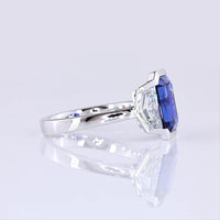 14K White Gold Emerald Cut Three-Stone Ring with 4.73 Carats Blue Lab Gemstone and 1.54 Carats Cadillac-Cut Lab Diamonds - 6.27 Carats Total Carat Weight - Covaloro Fine Jewelry