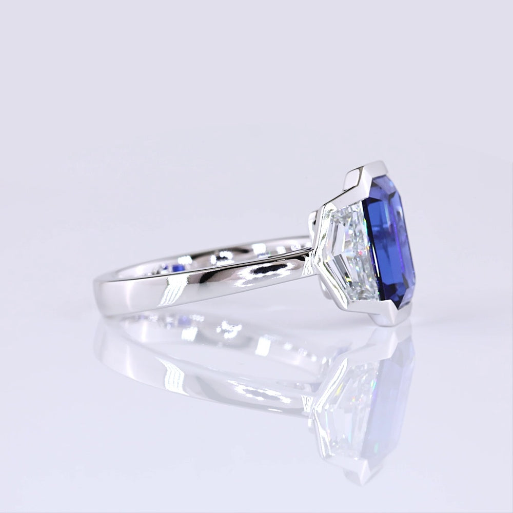 14K White Gold Emerald Cut Three-Stone Ring with 4.73 Carats Blue Lab Gemstone and 1.54 Carats Cadillac-Cut Lab Diamonds - 6.27 Carats Total Carat Weight - Covaloro Fine Jewelry