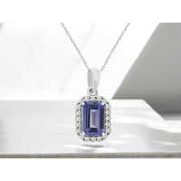 14K White Gold Halo Pendant with Emerald-Cut Tanzanite and Round Diamond Accents - 0.60 Carat Tanzanite and 0.09 Carat Total Diamond Weight - Royal Jewelry
