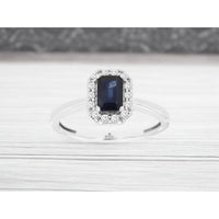 14K White Gold Halo Ring with Emerald-Cut Sapphire and Round Diamonds - 0.70 Carat Sapphire & 0.15 Carat Total Diamond Weight - Royal Jewelry
