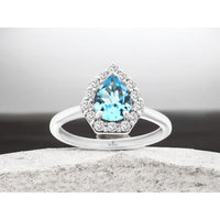 14K White Gold Halo Ring with Pear Cut Blue Topaz and Round Diamonds - 1.15 Carat Blue Topaz and 0.33 Carat Diamond Total Weight - Royal Jewelry