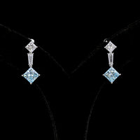 14K White Gold Hanging Earrings with Princess Cut Fancy Vivid Blue Lab Diamonds and Tapered Baguette Accents - 4.48 Carats Total Diamond Weight - Covaloro Fine Jewelry