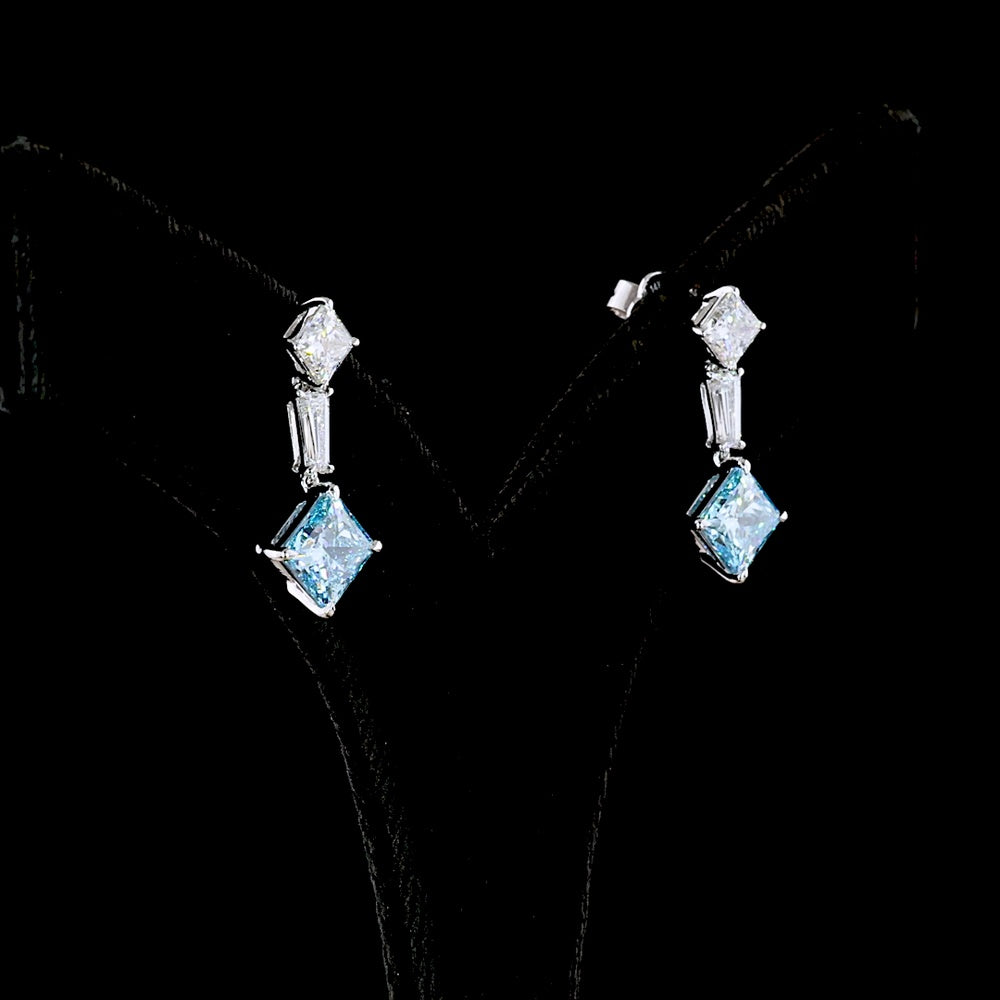 14K White Gold Hanging Earrings with Princess Cut Fancy Vivid Blue Lab Diamonds and Tapered Baguette Accents - 4.48 Carats Total Diamond Weight - Covaloro Fine Jewelry