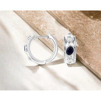 14K White Gold Huggie Earrings with Bezel-Set Oval Sapphires and Round Diamonds - 0.48 Carat Total Sapphire Weight and 0.18 Carat Total Diamond Weight - Royal Jewelry