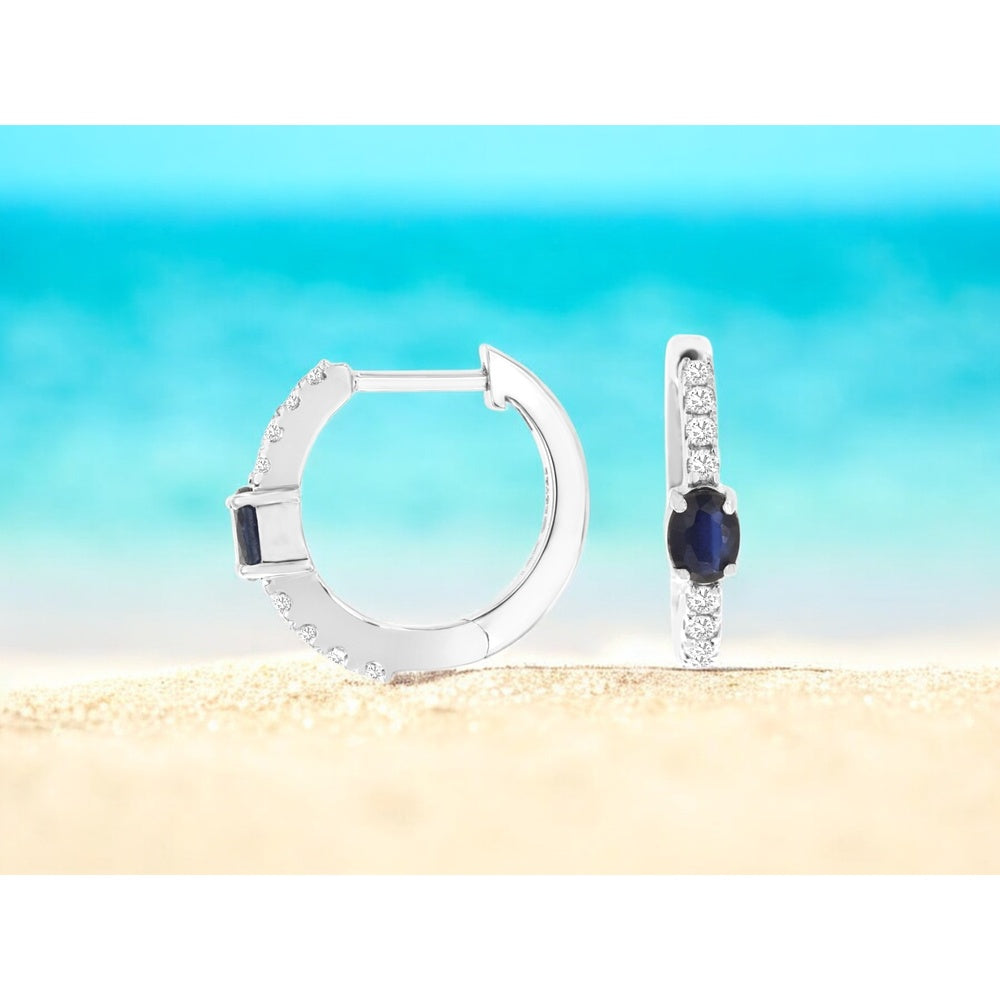 14K White Gold Huggie Earrings with Oval Sapphires and Pavé-Set Round Diamonds - 0.50 Carat Total Sapphire Weight and 0.20 Carat Total Diamond Weight - Royal Jewelry