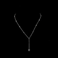 14K White Gold Lariat Necklace with 9 Bezel-Set Round Lab Diamonds and 1.04 Carat Prong-Set Emerald Cut Lab Diamond Center - 1.46 Carat Total Diamond Weight - Covaloro Fine Jewelry