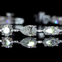 14K White Gold Mixed Shape Station Bracelet with Emerald, Pear, Oval, and Round Cut Natural Diamonds - 7.20 Carats Total Diamond Weight - Covaloro Fine Jewelry