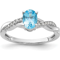 14K White Gold Oval 7x5mm Blue Topaz and Diamond Crossover Ring with 14 Round Diamonds - December Birthstone by 0