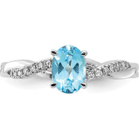 14K White Gold Oval 7x5mm Blue Topaz and Diamond Crossover Ring with 14 Round Diamonds - December Birthstone by 0