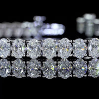 14K White Gold Oval Cut Lab Diamond Tennis Bracelet - 8.68 Carats Total Diamond Weight, 56 Stones E-F Color VS1 Clarity, Prong Set North-South Orientation - Covaloro Fine Jewelry