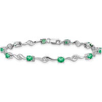 14K White Gold Oval Emerald and Round White Sapphire Curved Link Bracelet - 0.22 Carats Emerald, 0.027 Carats Sapphire Total Weight by Monteluci Fine Jewelry