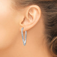 14K White Gold Oval Twist Hoop Earrings with Diamond Accents - 0.010 Carats Total Diamond Weight by Monteluci Fine Jewelry