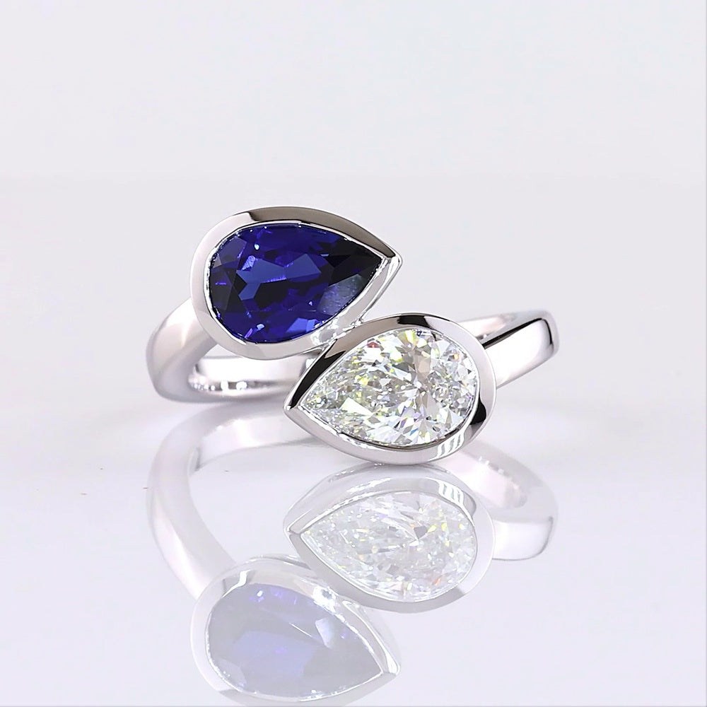 14K White Gold Pear Shape Toi et Moi Ring with Bezel Set Lab-Grown Blue Sapphire and Lab-Grown Diamond - 2.42 Carats Total Gem Weight - Covaloro Fine Jewelry