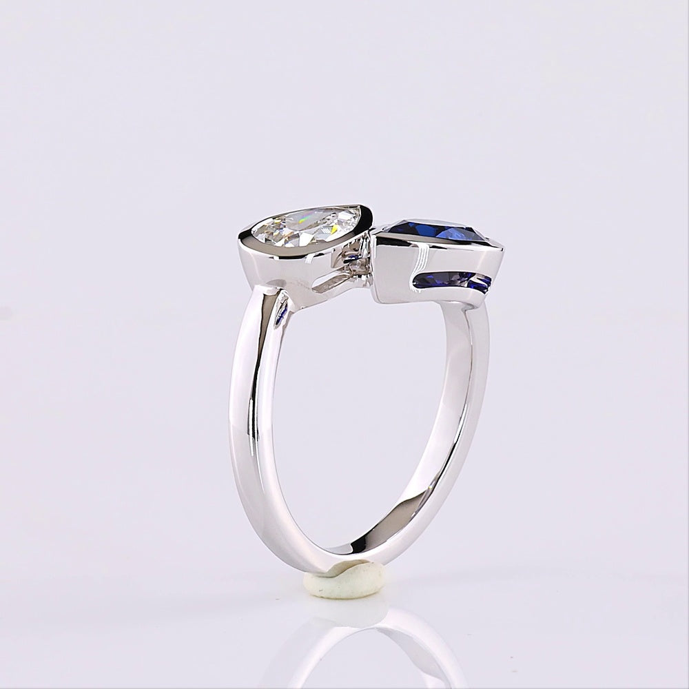 14K White Gold Pear Shape Toi et Moi Ring with Bezel Set Lab-Grown Blue Sapphire and Lab-Grown Diamond - 2.42 Carats Total Gem Weight - Covaloro Fine Jewelry