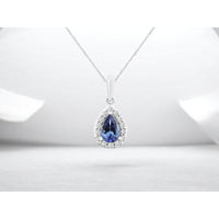 14K White Gold Pear-Shaped Tanzanite Pendant with Diamond Halo - 0.42 Carat Tanzanite and 0.12 Carat Total Diamond Weight - Royal Jewelry