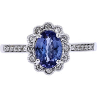 14K White Gold Ring with 0.80 Carats Oval Tanzanite and 0.18 Carats Diamond Halo
