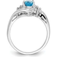 14K White Gold Ring with 1.00 Carat Oval Swiss Blue Topaz and 0.01 Carat Diamond Accents by Monteluci Fine Jewelry