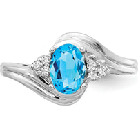 14K White Gold Ring with 1.00 Carat Oval Swiss Blue Topaz and 0.01 Carat Diamond Accents by Monteluci Fine Jewelry