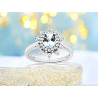 14K White Gold Starburst Halo Ring with Oval Aquamarine and Round Diamonds - 0.68 Carat Aquamarine and 0.25 Carat Total Diamond Weight - Royal Jewelry