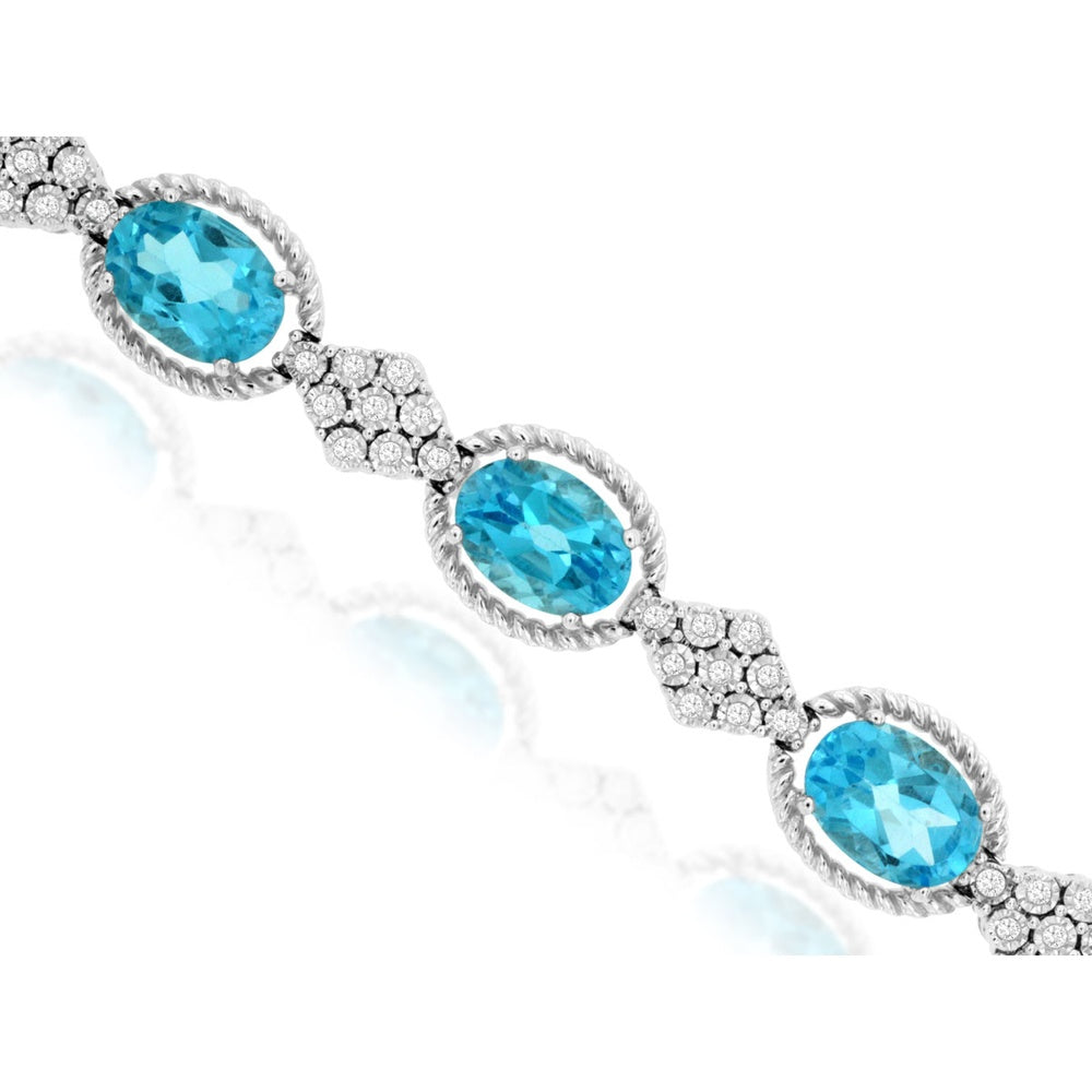14K White Gold Station Bracelet with Oval-Cut Blue Topaz and Diamond Cluster Links - 11.20 Carat Total Blue Topaz Weight and 0.33 Carat Total Diamond Weight - Royal Jewelry