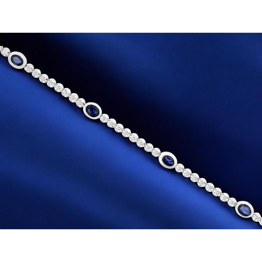 14K White Gold Tennis Bracelet with Bezel-Set Oval Sapphires and Round Diamonds - 1.80 Total Carat Weight (1.25 Carat Sapphire, 0.55 Carat Diamond) - Royal Jewelry