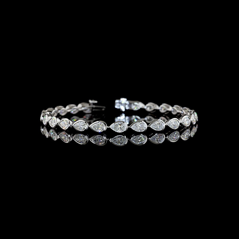 14K White Gold Tennis Bracelet with East-West Bezel Set Pear Shaped Lab Diamonds - 7.04 Carats Total Diamond Weight - Covaloro Fine Jewelry