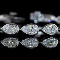 14K White Gold Tennis Bracelet with East-West Bezel Set Pear Shaped Lab Diamonds - 7.04 Carats Total Diamond Weight - Covaloro Fine Jewelry