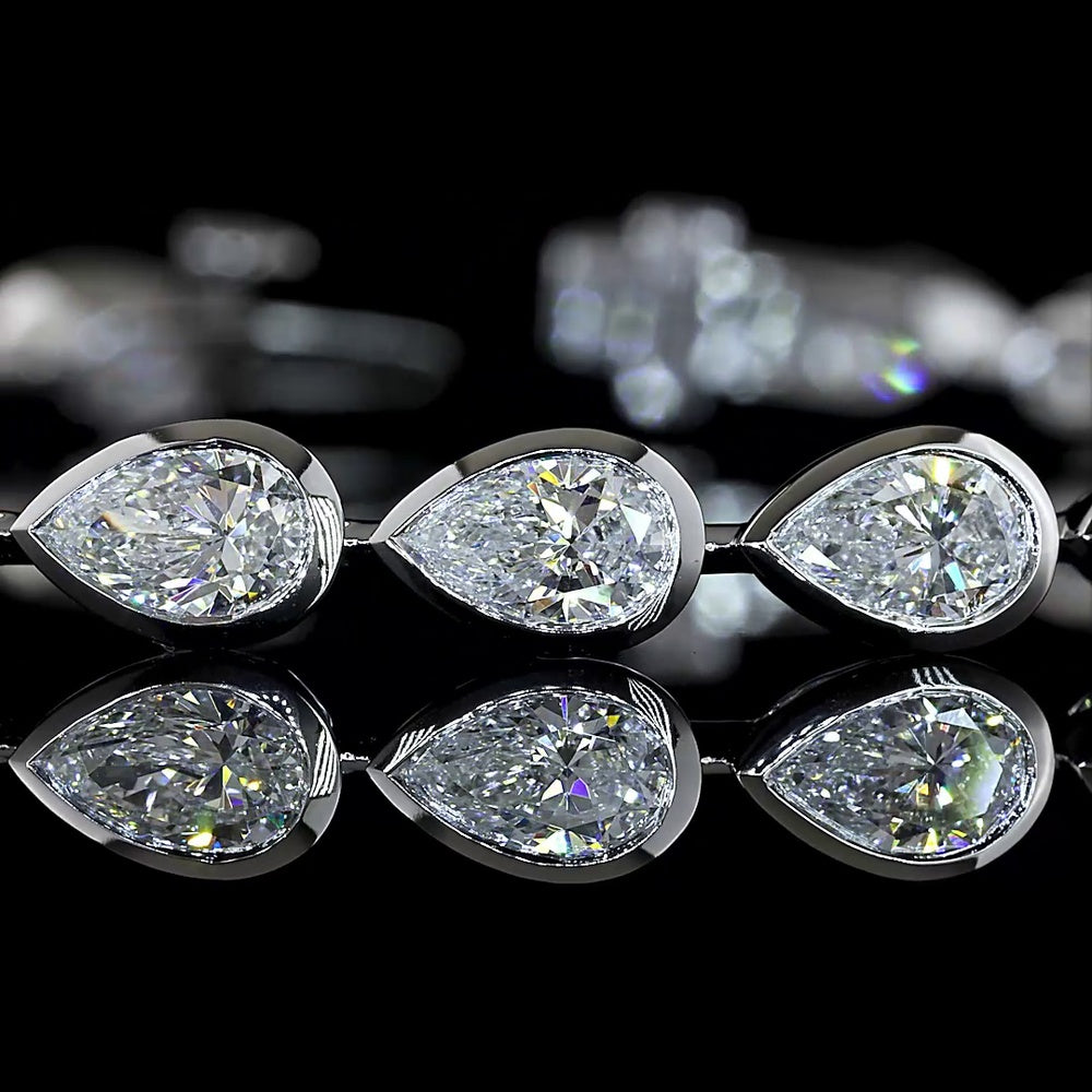 14K White Gold Tennis Bracelet with East-West Bezel Set Pear Shaped Lab Diamonds - 7.04 Carats Total Diamond Weight - Covaloro Fine Jewelry