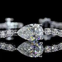 14K White Gold Tennis Bracelet with East-West Pear Shape Lab Diamond and 64 Round Brilliant Cut Lab Diamonds - 4.52 Carat Total Weight - Covaloro Fine Jewelry