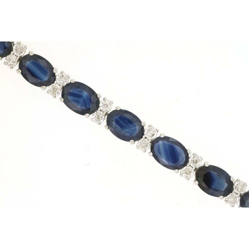 14K White Gold Tennis Bracelet with Oval Cut Sapphires and Diamond Accents - 20.00 Carat Total Sapphire Weight, 0.50 Carat Total Diamond Weight - Royal Jewelry