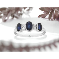 14K White Gold Three-Stone Oval Sapphire Ring with Milgrain Detail and Diamond Accents - 1.40 Carat Total Sapphire Weight, 0.16 Carat Total Diamond Weight - Royal Jewelry