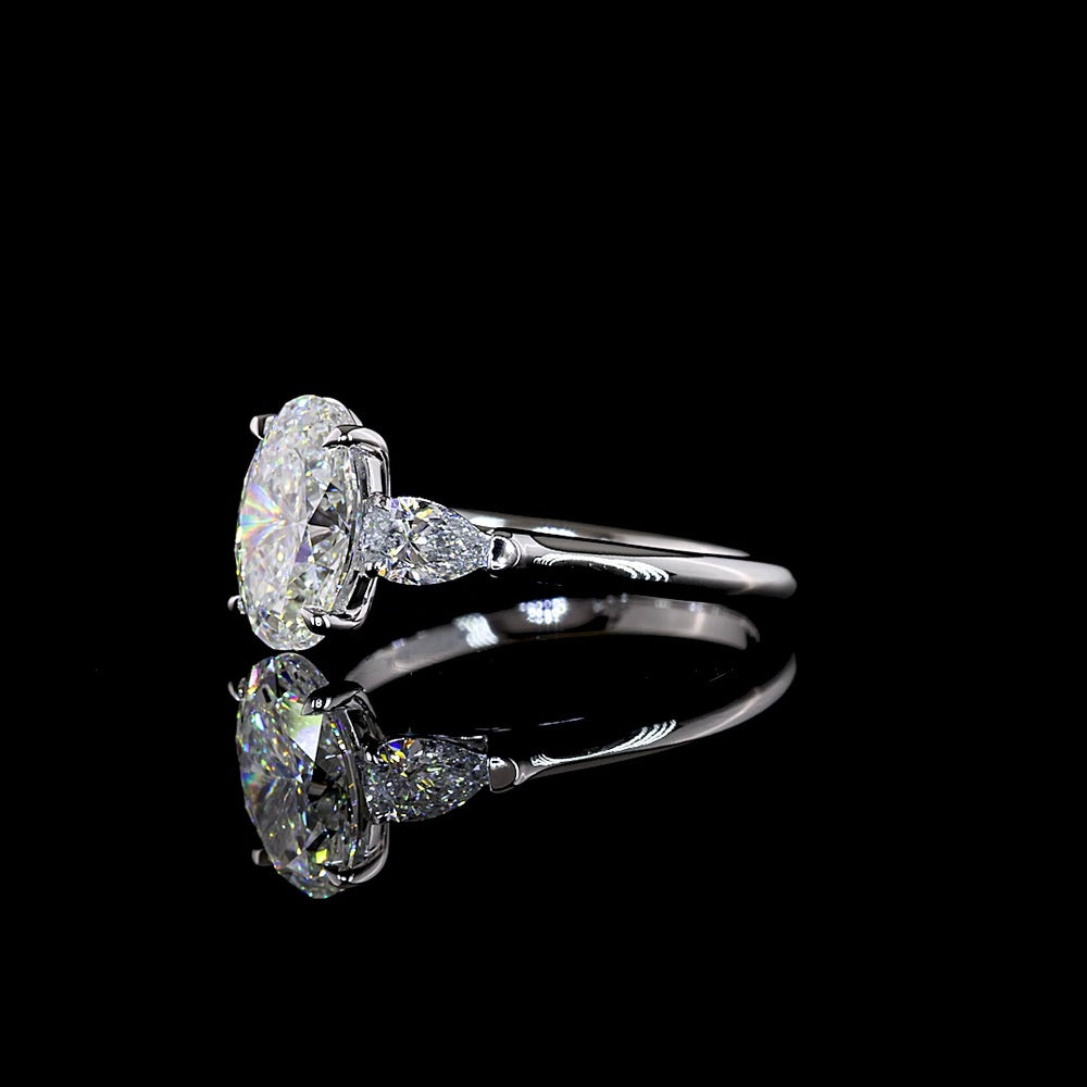 14K White Gold Three Stone Ring with 2.04 Carat Oval Lab Diamond and 0.47 Carat Pear Shape Side Stones - 2.51 Carat Total Diamond Weight - Covaloro Fine Jewelry