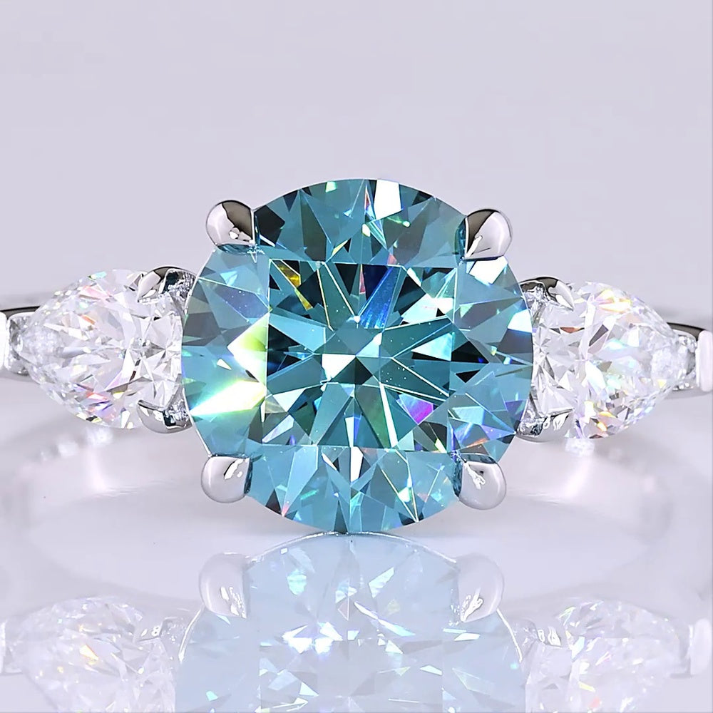 14K White Gold Three-Stone Ring with 2.28 Carat Round Fancy Vivid Blue Lab Diamond and 0.65 Carat Pear Shape White Diamonds - 2.93 Carat Total Weight - Covaloro Fine Jewelry