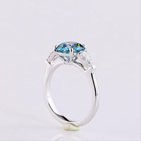 14K White Gold Three-Stone Ring with 2.28 Carat Round Fancy Vivid Blue Lab Diamond and 0.65 Carat Pear Shape White Diamonds - 2.93 Carat Total Weight - Covaloro Fine Jewelry