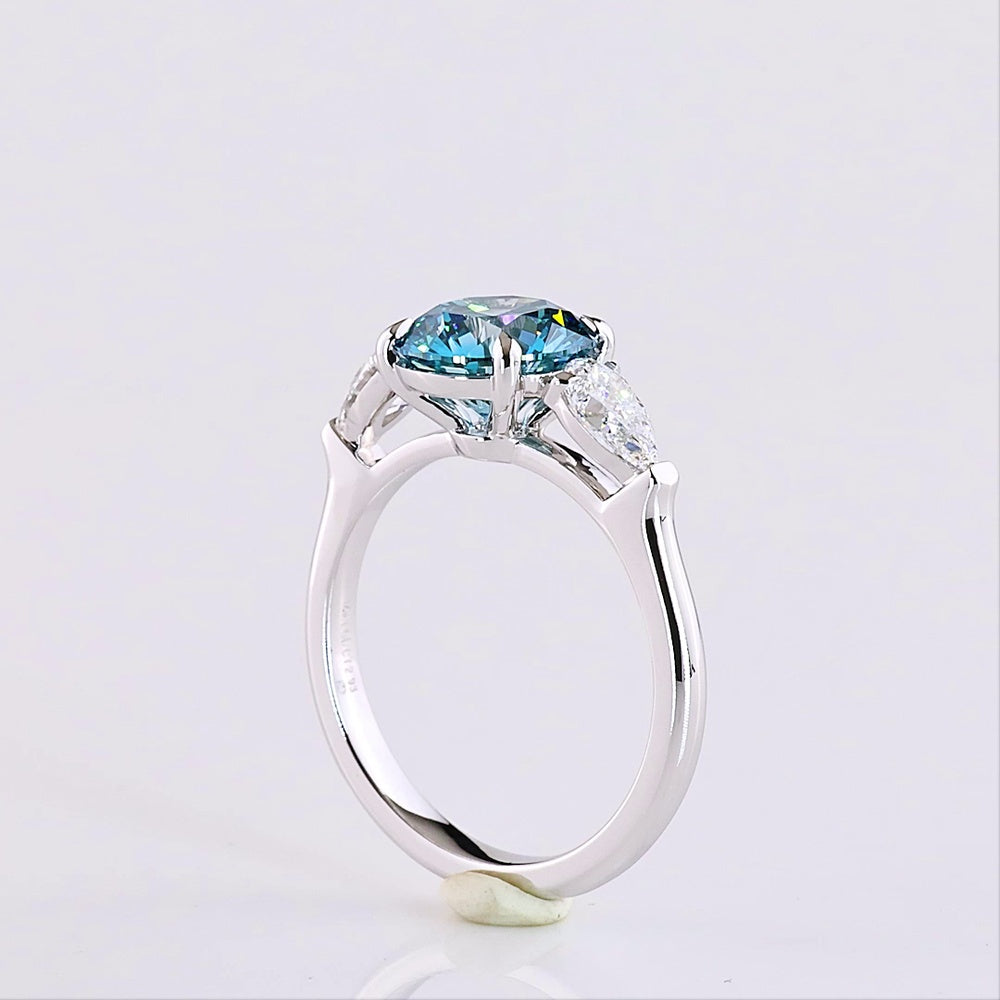 14K White Gold Three-Stone Ring with 2.28 Carat Round Fancy Vivid Blue Lab Diamond and 0.65 Carat Pear Shape White Diamonds - 2.93 Carat Total Weight - Covaloro Fine Jewelry