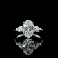 14K White Gold Three-Stone Ring with 2.69 Carat Oval Cut Lab Diamond and 0.66 Carat Pear Shaped Side Stones - IGI Certified E VVS2 - Covaloro Fine Jewelry